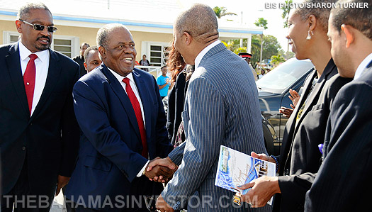 Prime Minister Hubert Ingraham greets Public Hospitals Authority managing director Herbert Brown