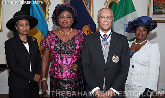 Prime Minister Hubert Ingraham joins in with a toast