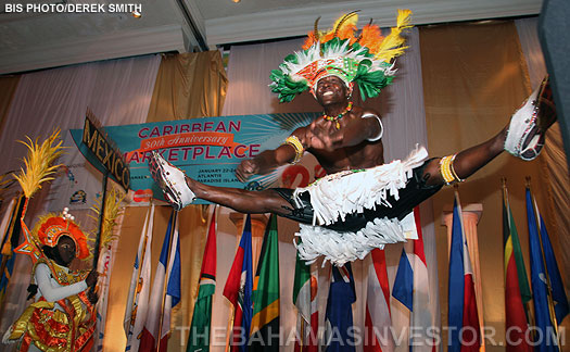 A dancer preforms an acrobatic leap to entertain