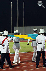 The Royal Bahamas Police Force carry the national flag at the opening ceremony.