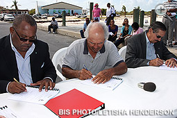 From left: Public Works and Transport Minister Neko Grant; Laurin Knowles, contractor; and Lawrence Cartwright, MP for Long Island. (BIS photo/Letisha Henderson)