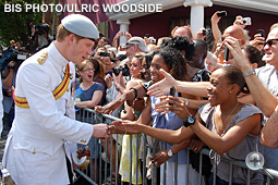 Prince Harry greets members of the general public.