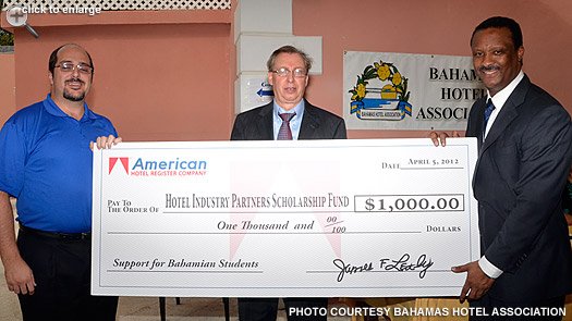 American’s director for sales presents the Hotel Industry Partners Scholarship Fund contribution