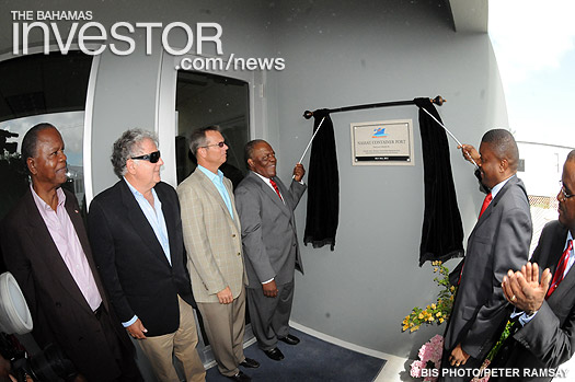 Prime Minister Hubert Ingraham and State Minister of Finance Zhivargo Laing unveil the plaque to officially open the new Nassau Container Port at Arawak Cay