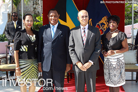 official photograph with their respective wives, Bernadette Christie (far left) and Lady Foulkes