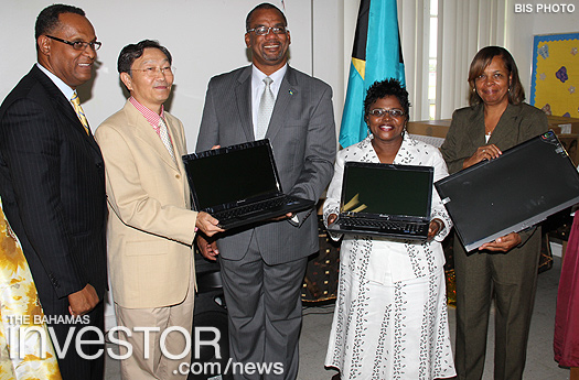 Ambassador of the People’s Republic of China to The Bahamas presents computers to Education Minister Jerome Fitzgerald