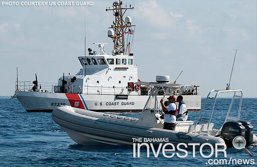 Search and rescue personnel from the Bahamas Air Sea Rescue Association team up with the US