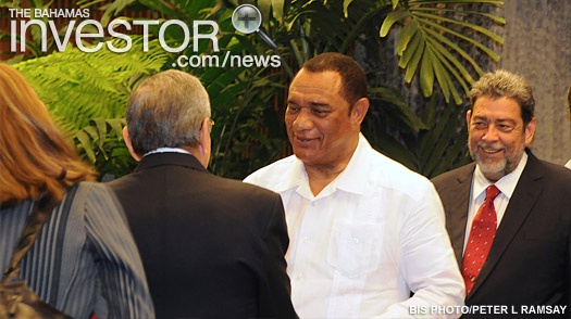 The Prime Minister (centre) is greeted by Raul Modesto Castro Ruz